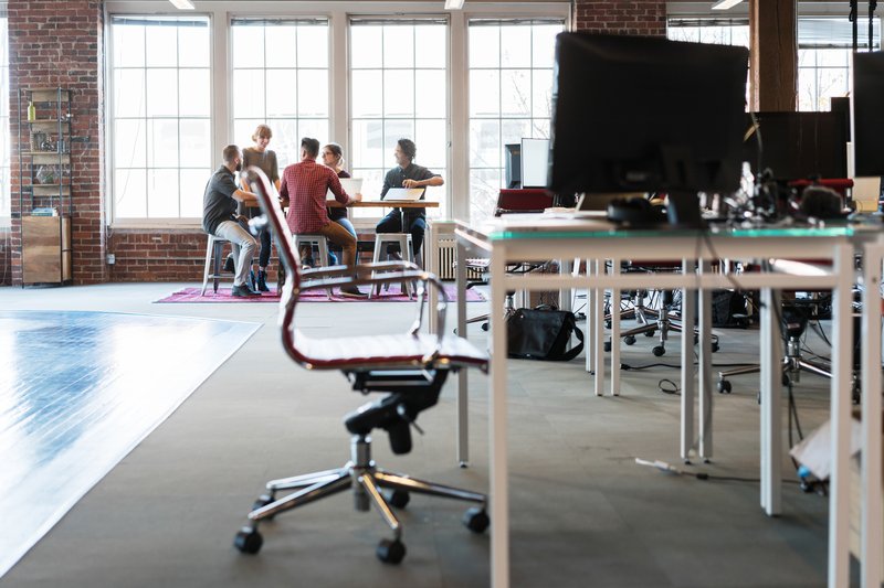 The Business Loan Co. team gathered around a table in their Adelaide office